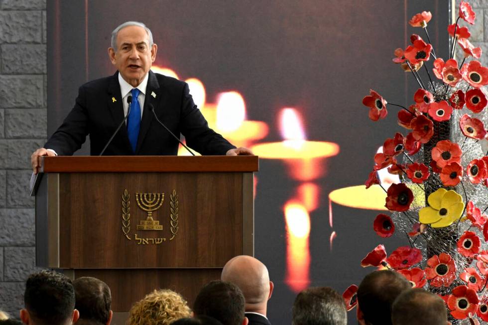 Israeli Prime Minister Benjamin Netanyahu speaks at a memorial ceremony for those killed by Ham ...