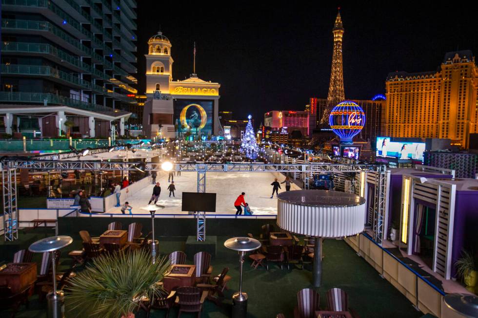 People enjoy some skating on the ice rink at The Cosmopolitan of Las Vegas in this Review-Journ ...