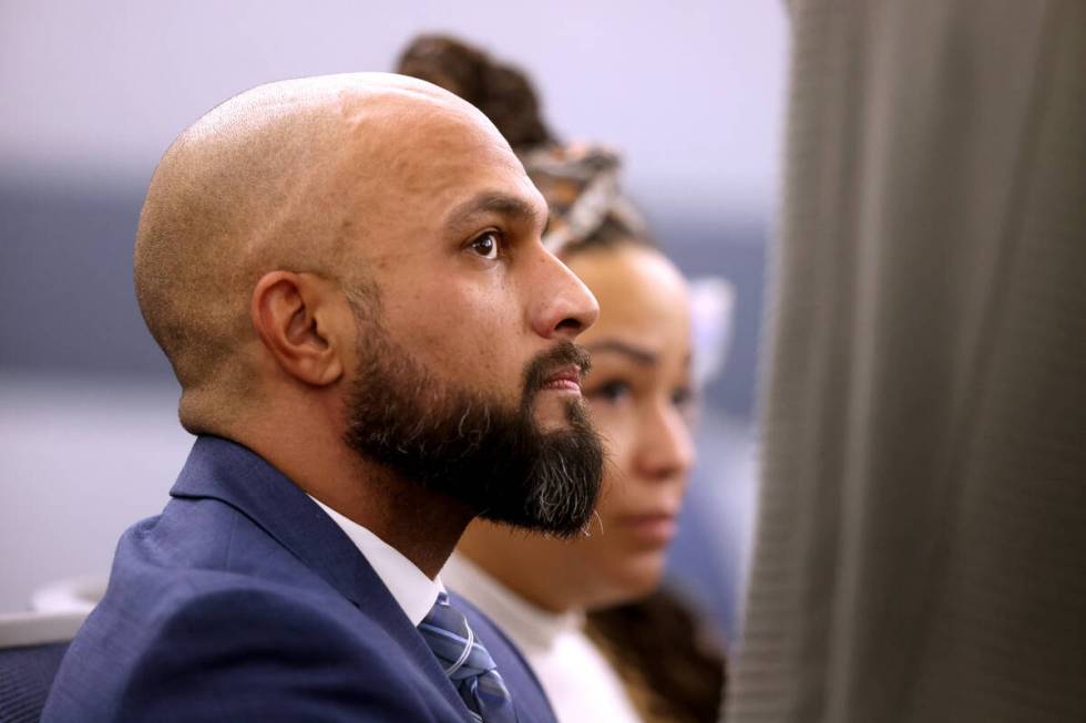 Metropolitan Police Department Sgt. Kevin Menon waits in court for a bail hearing at the Region ...