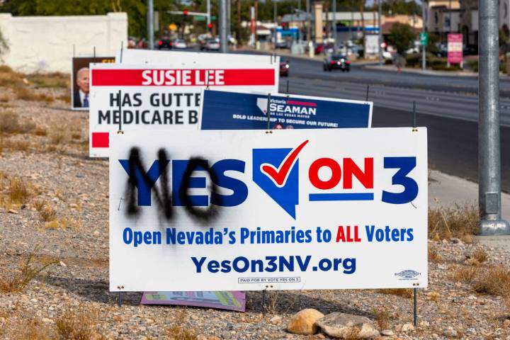 A vandalized election sign is seen along Buffalo Drive on Election Day in Las Vegas, Tuesday, N ...