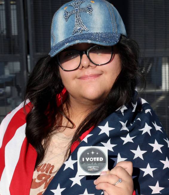 Ammy Rivera of Las Vegas shows her unique Allegiant Stadium “I VOTED” sticker aft ...