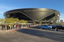 People line up outside the Raiders' Allegiant Stadium to vote on Election Day in Las Vegas. (Ke ...