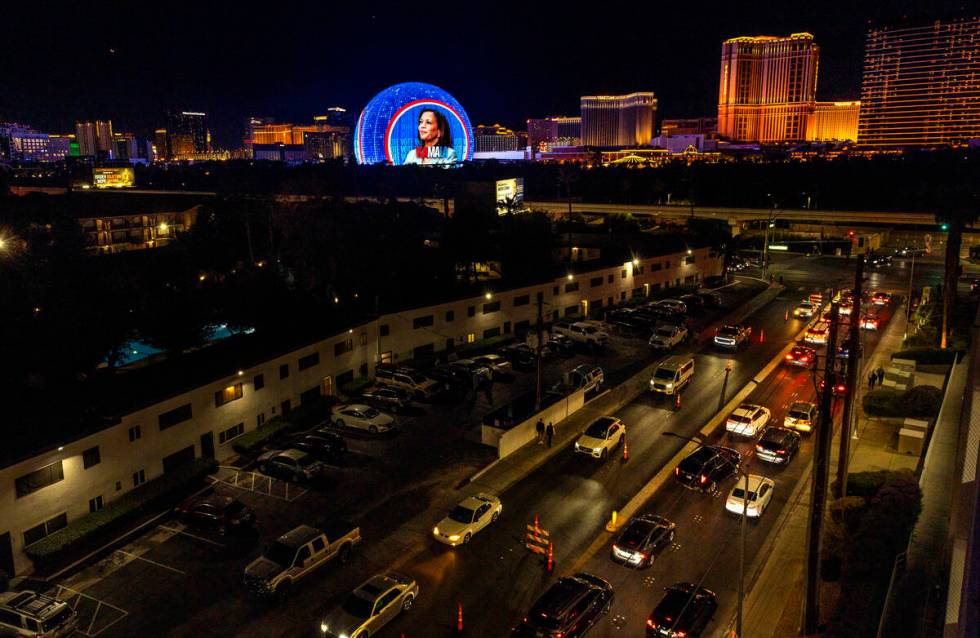 The Sphere shows a political ad for Vice President Kamala Harris as people continue wait in a l ...