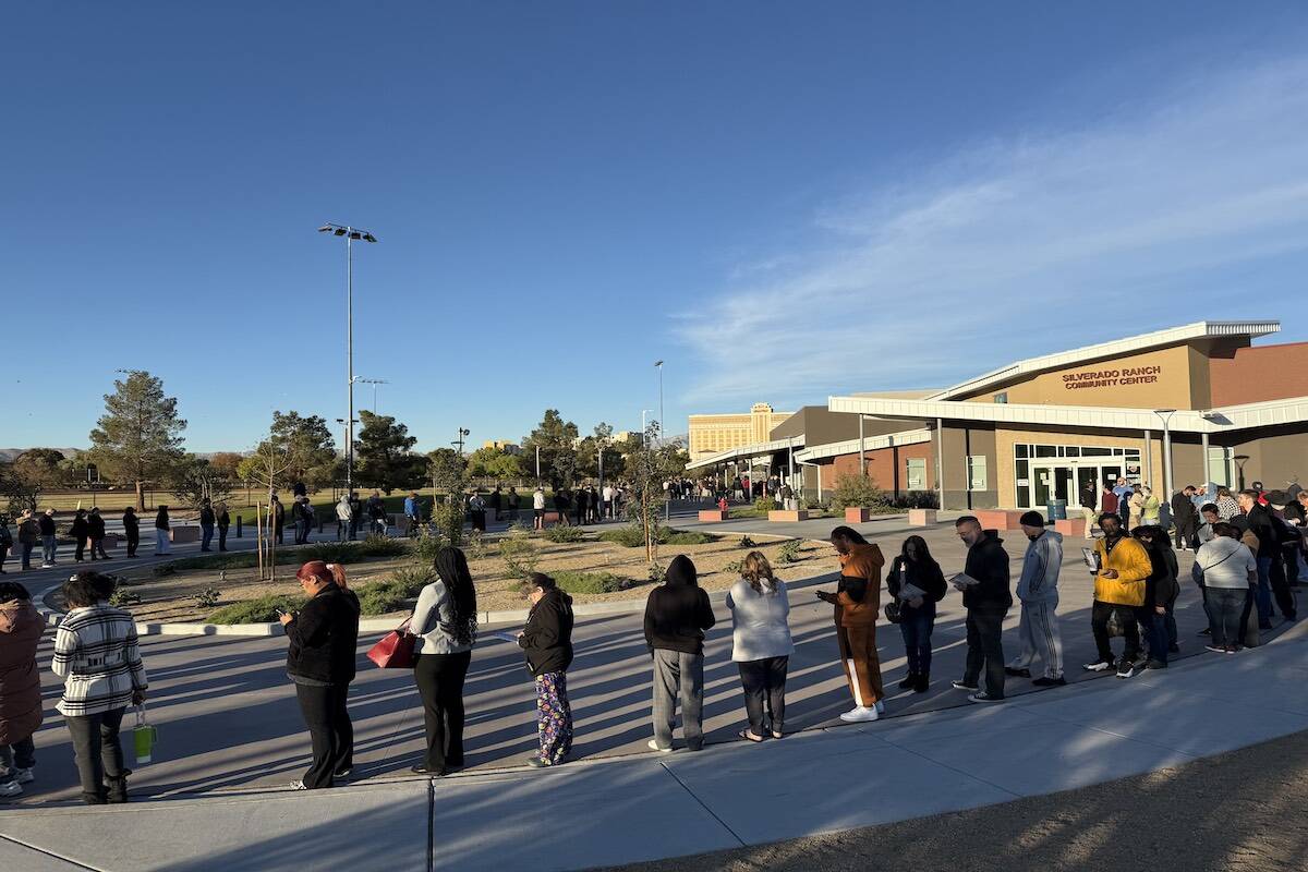 As the doors opened at the Silverado Ranch Community Center a line of about 200 people were in ...