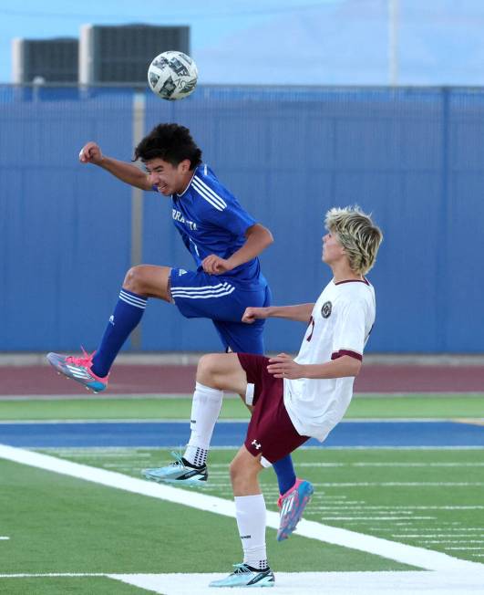 Sierra Vista midfielder Jacob Perez (4) heads the ball in front of Faith Lutheran forward Tohot ...