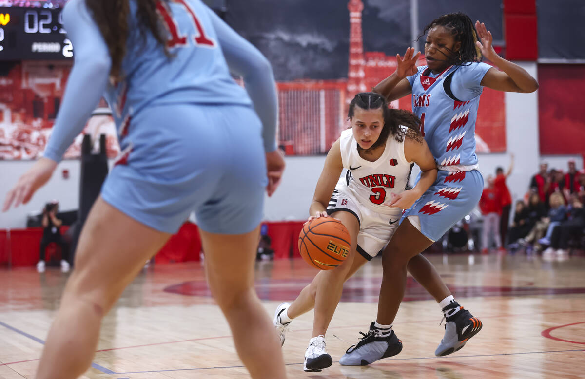 UNLV Lady Rebels guard Kiara Jackson (3) drives the ball against Loyola Marymount Lions guard Z ...