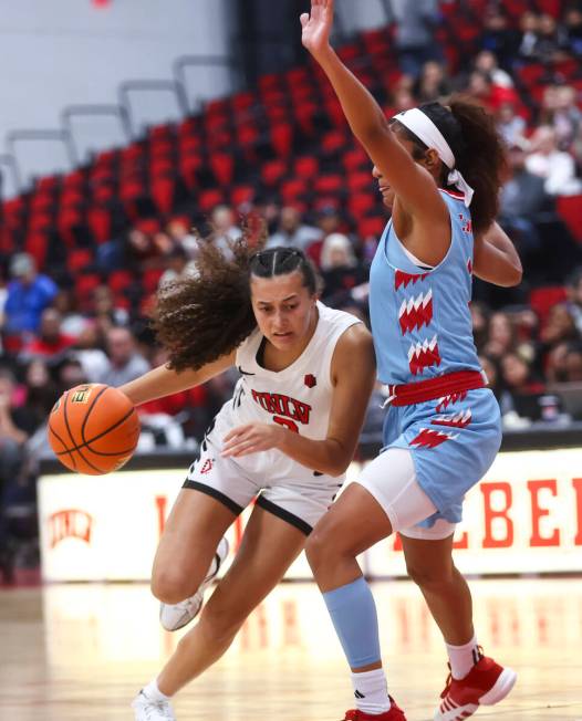 UNLV Lady Rebels guard Kiara Jackson (3) drives the ball against a Loyola Marymount player duri ...