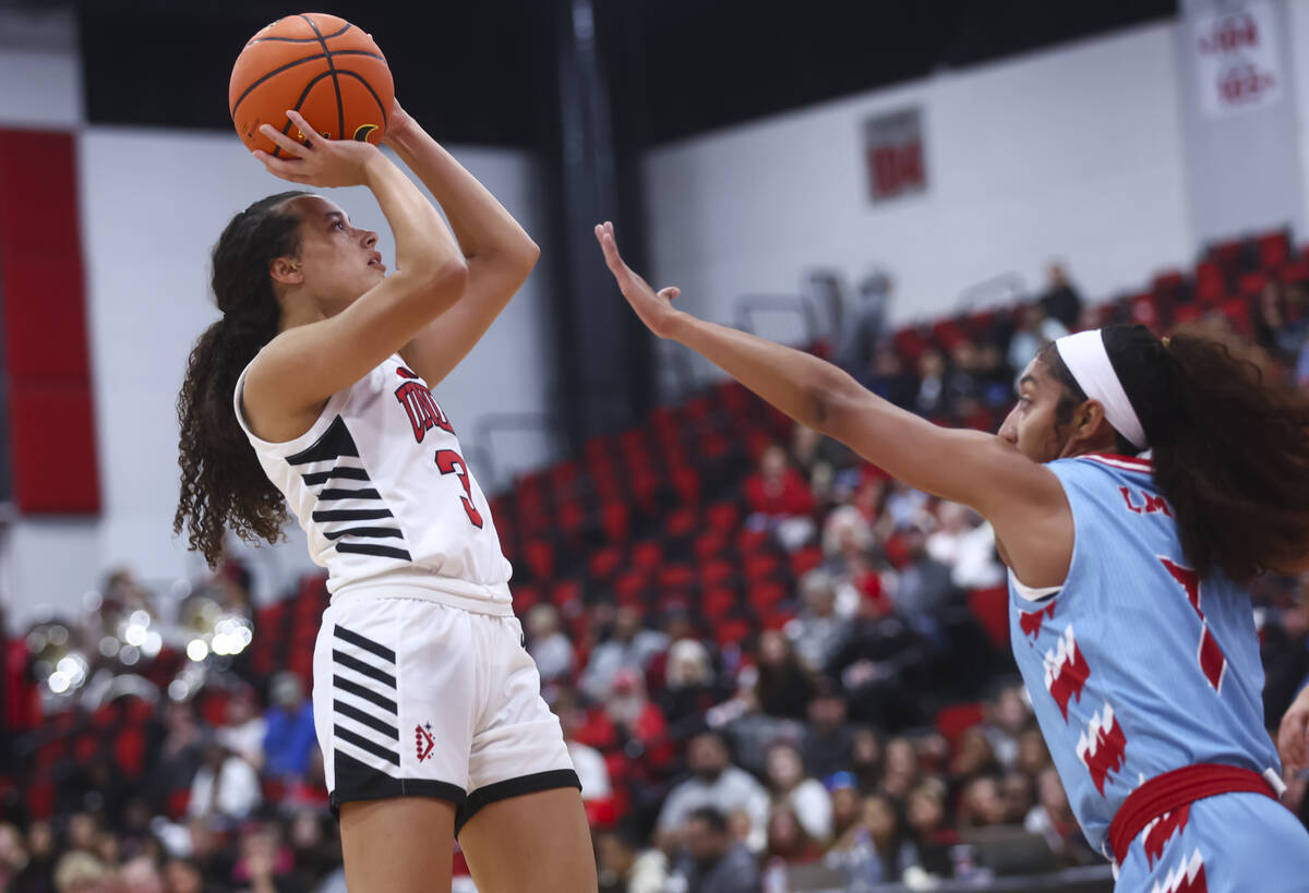 UNLV Lady Rebels guard Kiara Jackson (3) shoots over Loyola Marymount Lions guard Naudia Evans ...