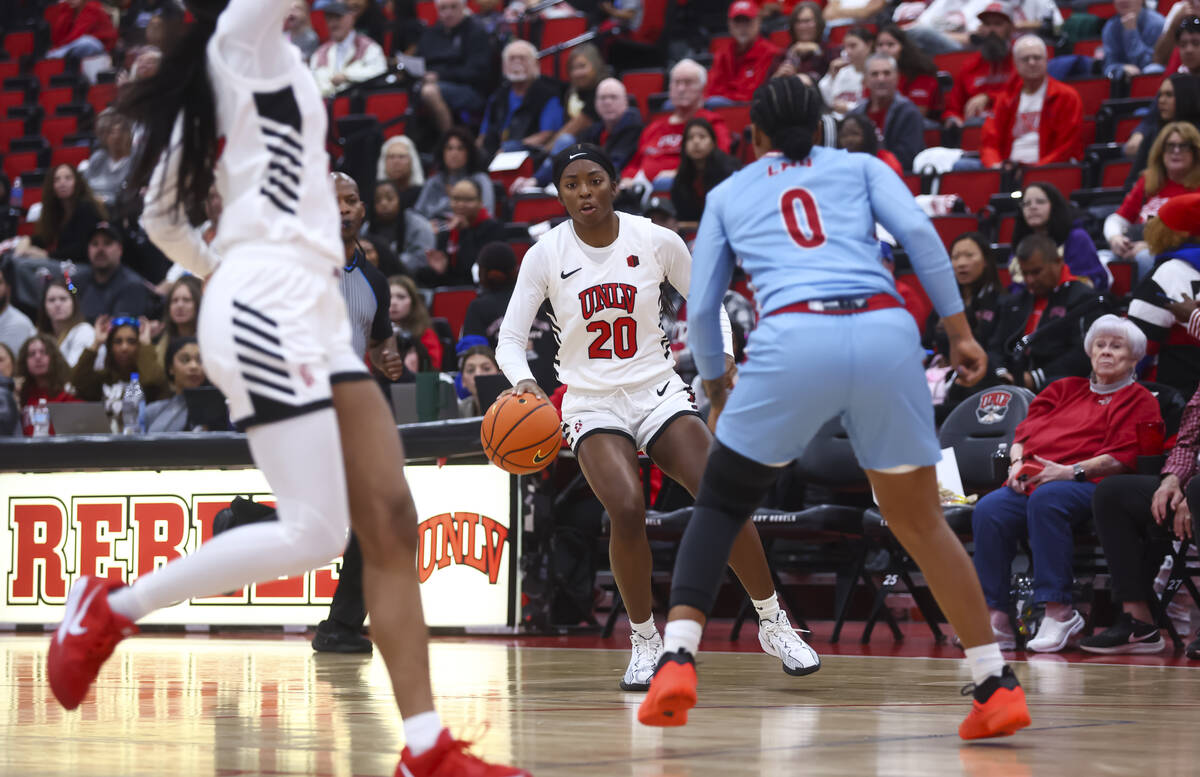 UNLV Lady Rebels forward Macie James (20) brings the ball up court against Loyola Marymount Lio ...