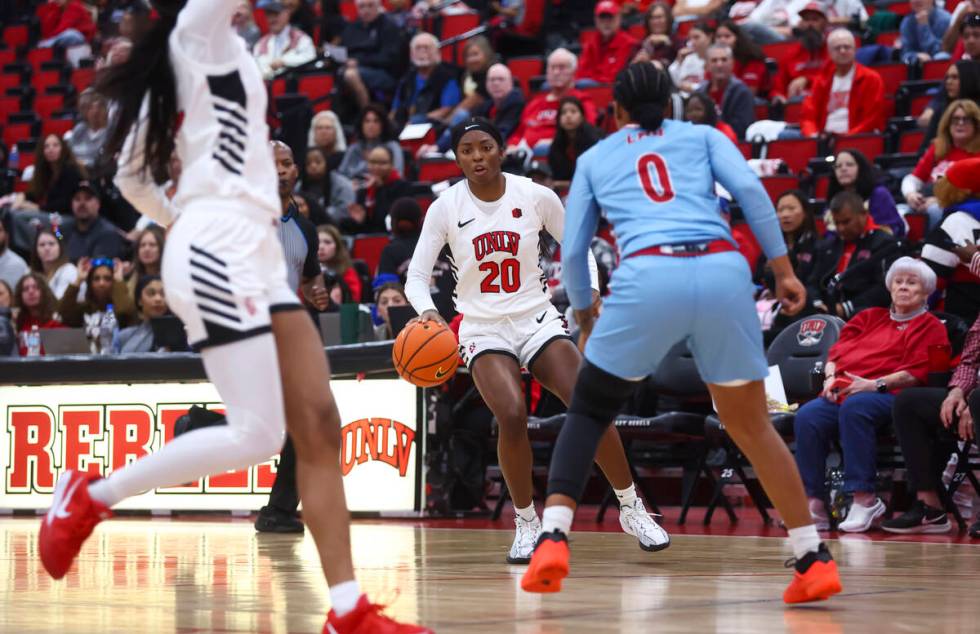 UNLV Lady Rebels forward Macie James (20) brings the ball up court against Loyola Marymount Lio ...