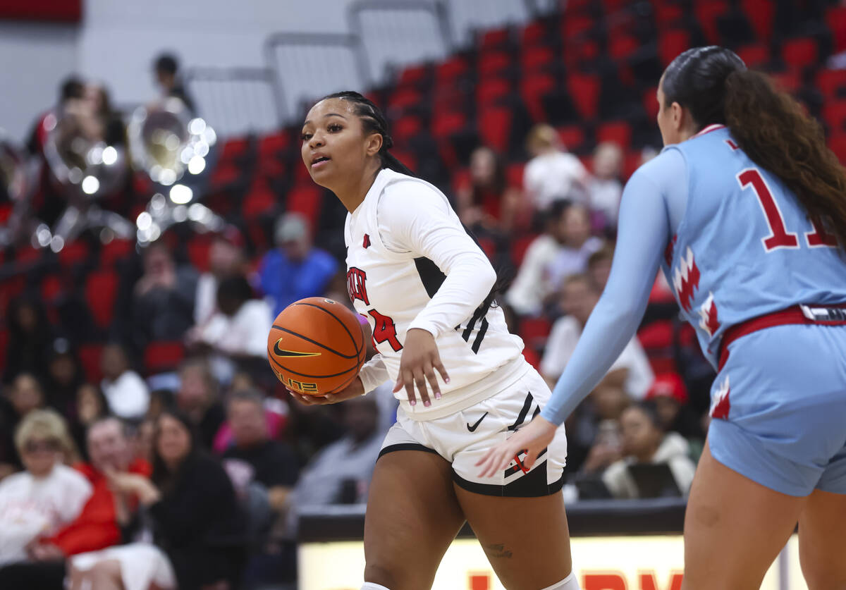 UNLV Lady Rebels forward Alyssa Brown (44) looks to pass the ball in front of Loyola Marymount ...