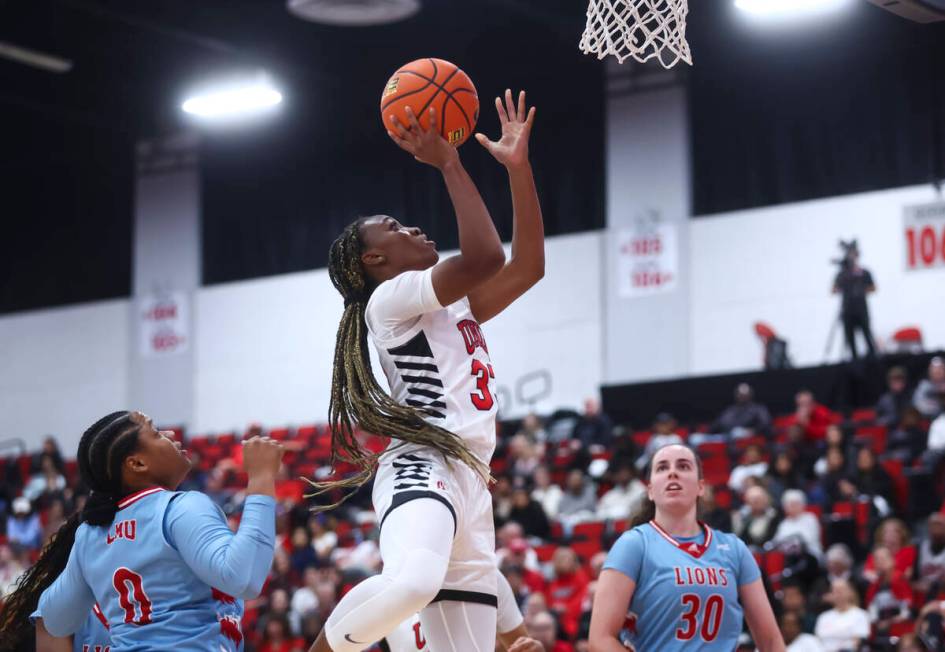 UNLV Lady Rebels guard Amarachi Kimpson (33) lays up the bal against the Loyola Marymount Lions ...