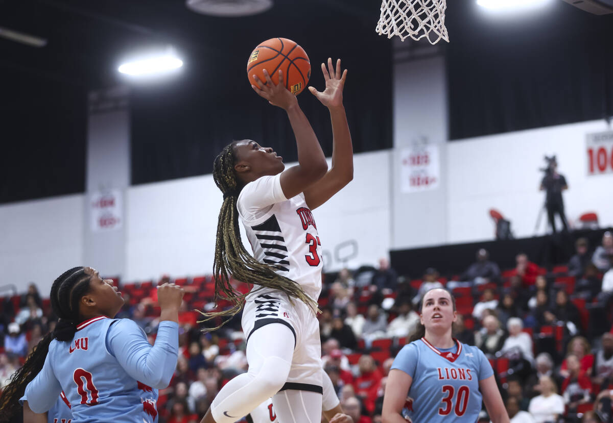 UNLV Lady Rebels guard Amarachi Kimpson (33) lays up the bal against the Loyola Marymount Lions ...