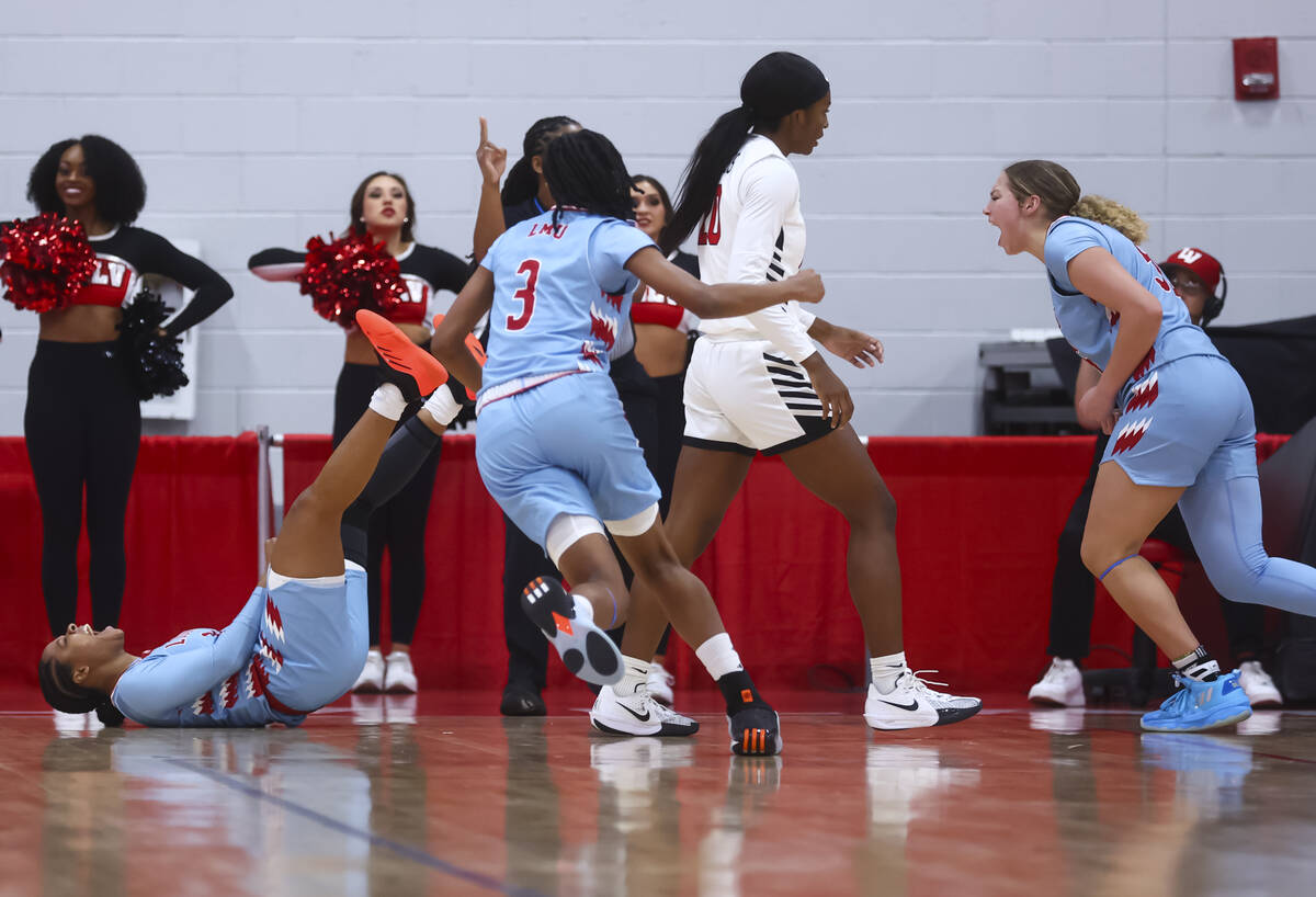 Loyola Marymount Lions guard Brandi Williams, left, reacts after drawing a foul against the UNL ...