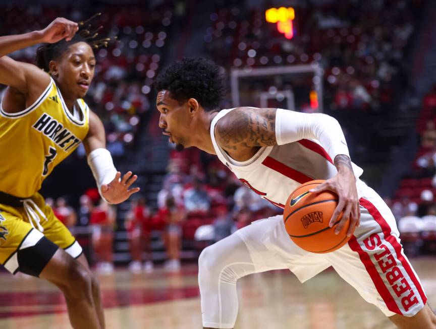 UNLV Rebels guard Jailen Bedford (14) drives to the basket against Alabama State Hornets guard ...