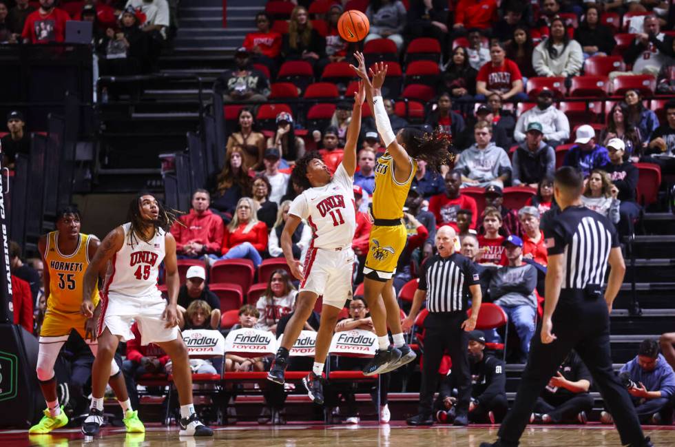 Alabama State Hornets guard CJ Hines (3) shoots over UNLV Rebels guard Dedan Thomas Jr. (11) du ...