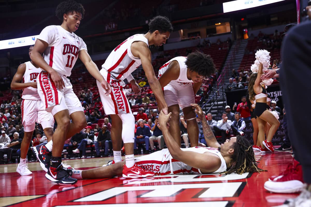 UNLV Rebels forward Jeremiah Cherry (45) gets lifted up by teammates during the second half of ...