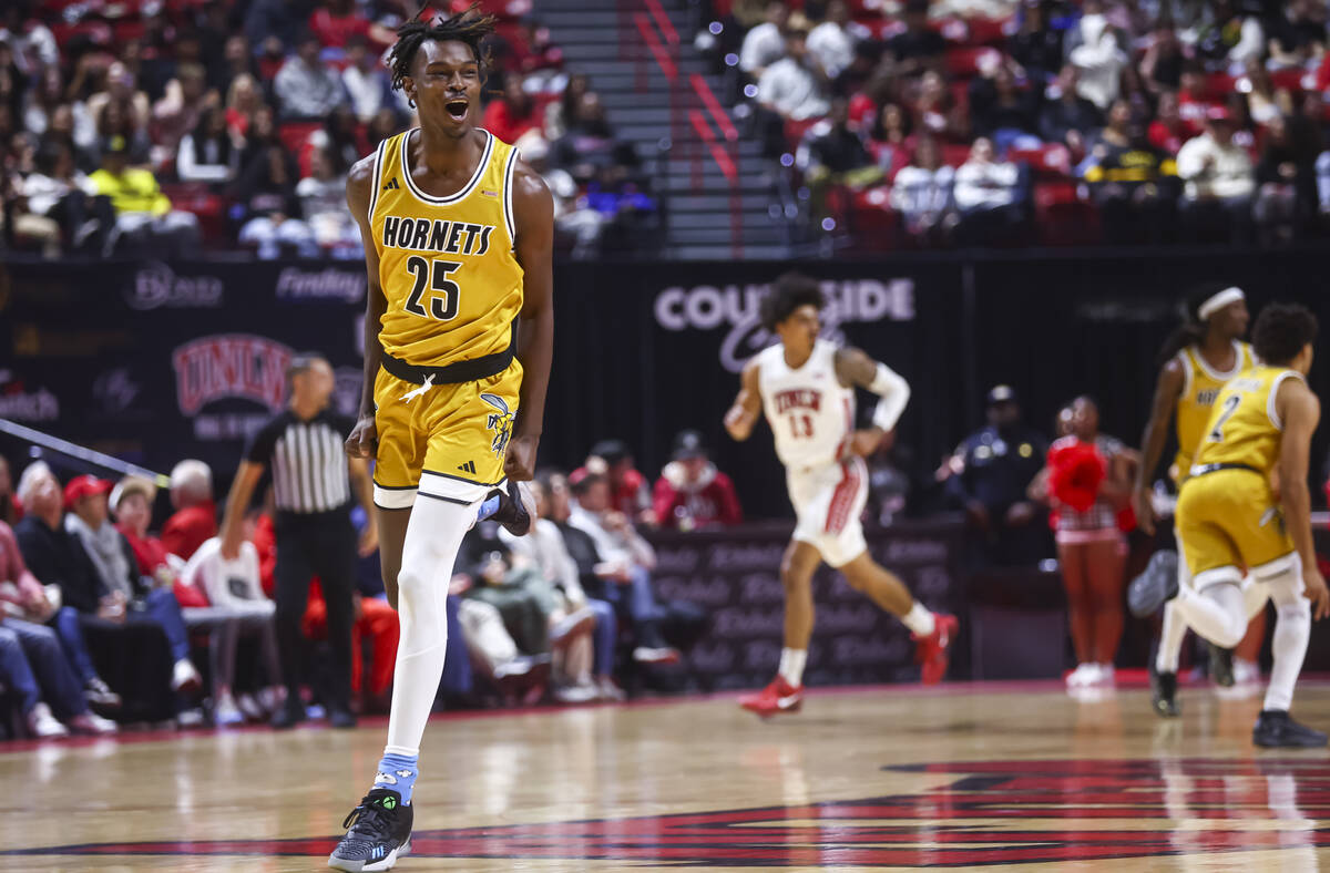 Alabama State Hornets forward Jasteven Walker (25) reacts after scoring against UNLV during the ...