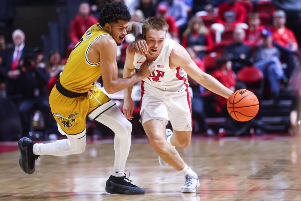 UNLV Rebels guard Jace Whiting (15) brings the ball up court against Alabama State Hornets guar ...