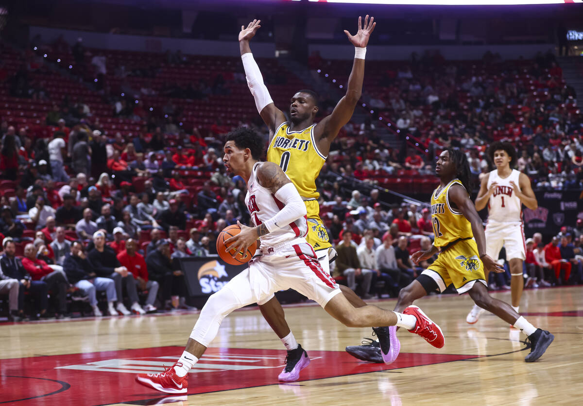 UNLV Rebels guard Jailen Bedford (14) drives to the basket past Alabama State Hornets forward D ...