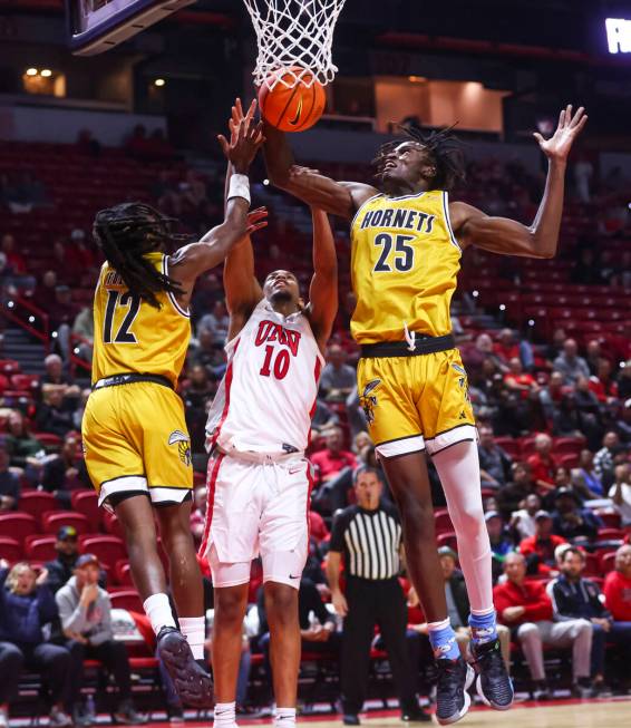 Alabama State Hornets forward Jasteven Walker (25) grabs the rebound against UNLV Rebels guard ...