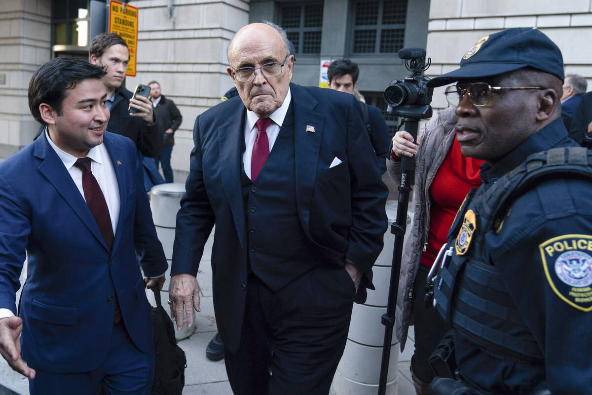 FILE - Former Mayor of New York Rudy Giuliani leaves the federal courthouse in Washington, Dec. ...