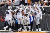 Las Vegas Raiders cornerback Jack Jones (18) is congratulated by teammates after scoring a touc ...