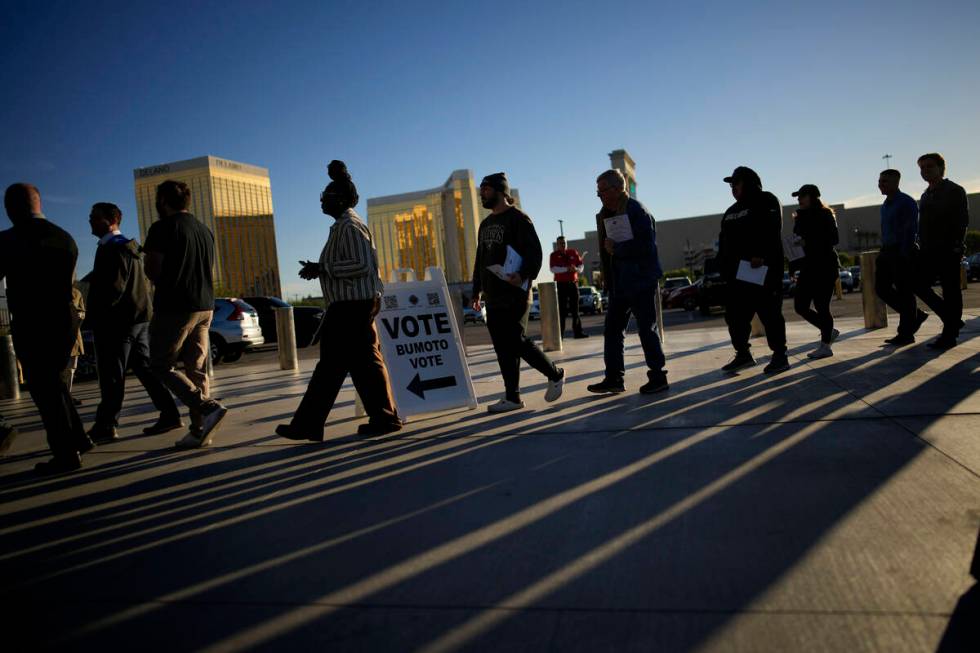 People line up to vote outside Allegiant Stadium, Tuesday, Nov. 5, 2024, in Las Vegas. (AP Phot ...