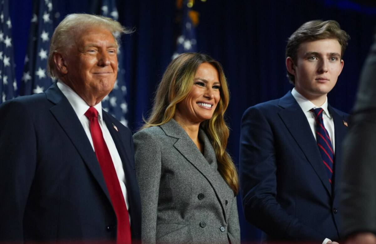 Donald Trump, former first lady Melania Trump and Barron Trump listen at an election night watc ...