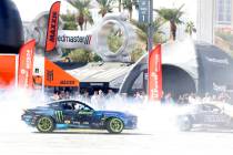 A professional drivers put on a tire slaying show at Hoonigan’s burn pit during the firs ...