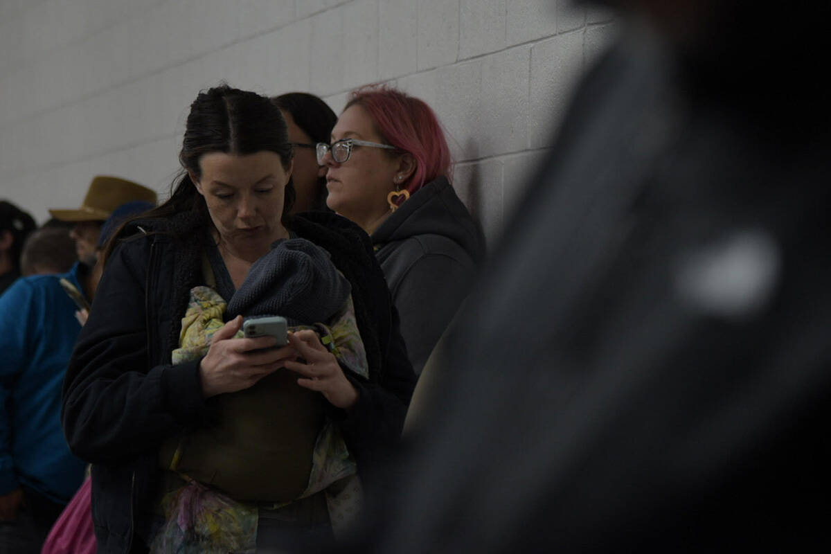 People wait inside the Bob Rudd community center to cast their ballots on Election Day, Tuesday ...