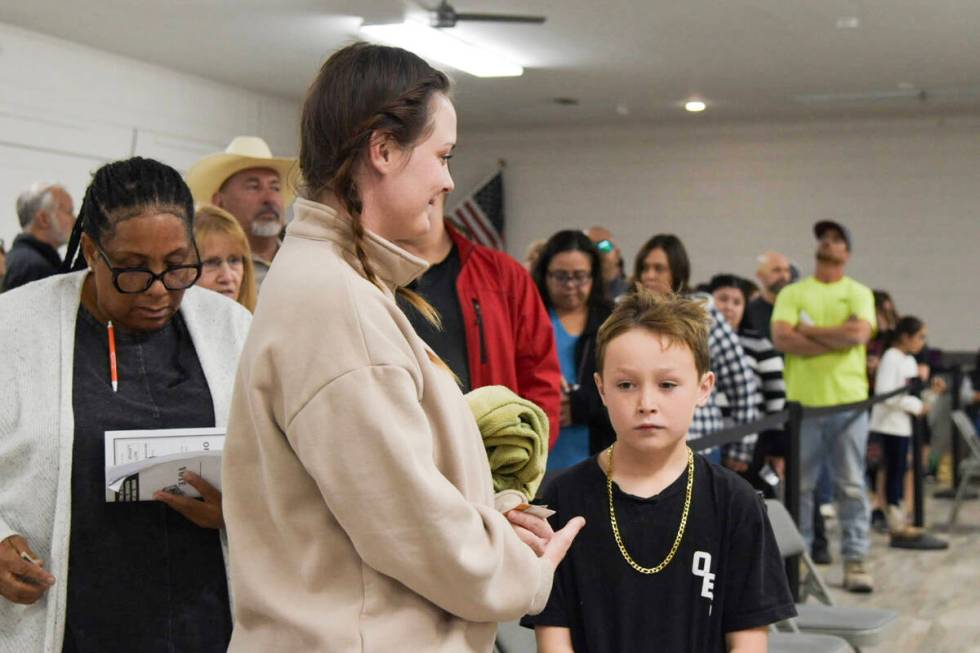 Nye County residents wait in line at the Bob Ruud community center where roughly 1,000 voters h ...