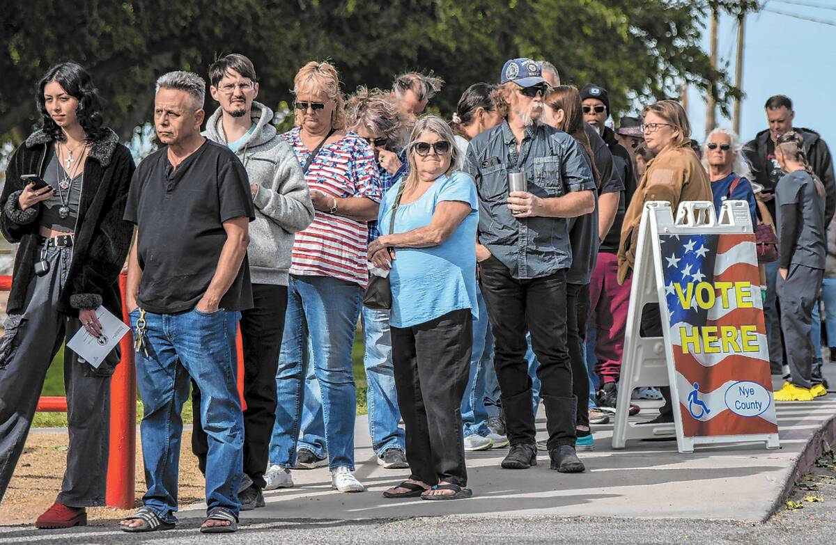 Nye County residents wait in line at the Bob Ruud community center where roughly 1,000 voters h ...