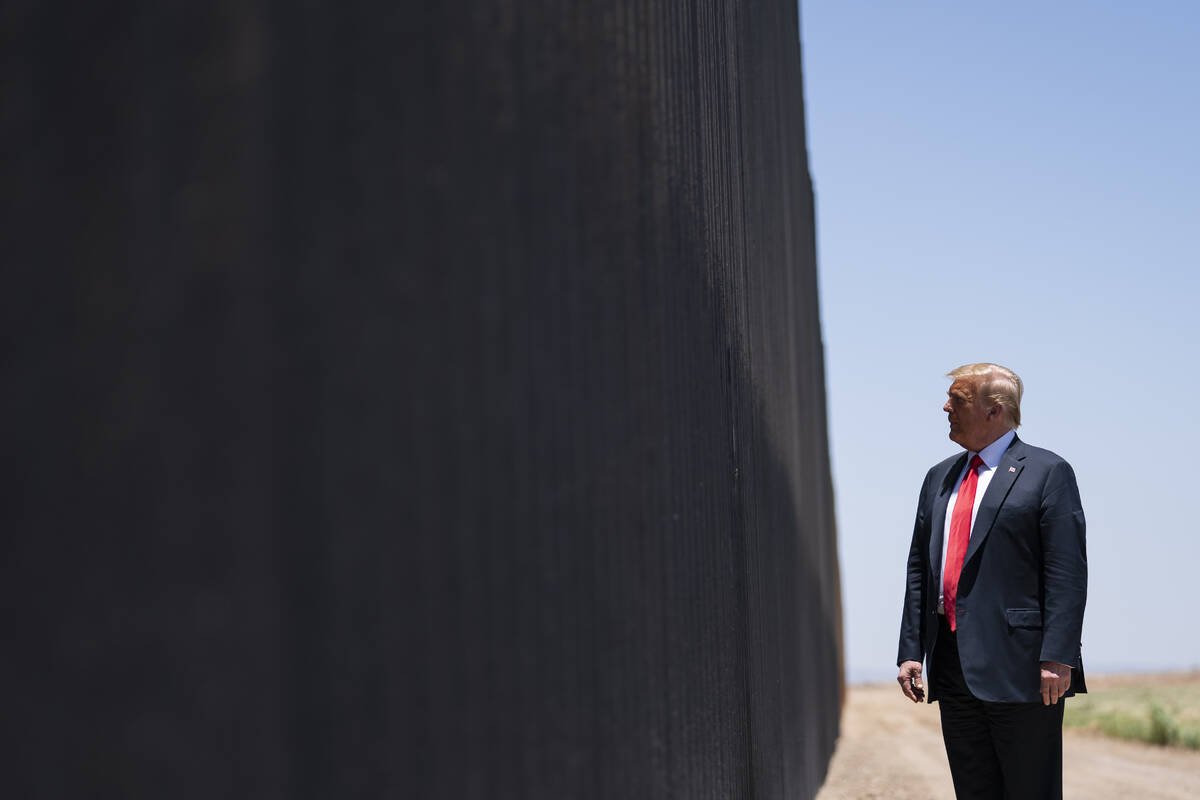 In this June 23, 2020, file photo, President Donald Trump tours a section of the border wall in ...