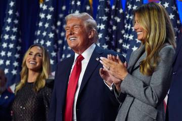 Republican presidential nominee former President Donald Trump stands on stage with former first ...