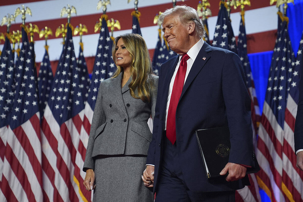 Republican presidential nominee former President Donald Trump stands with former first lady Mel ...