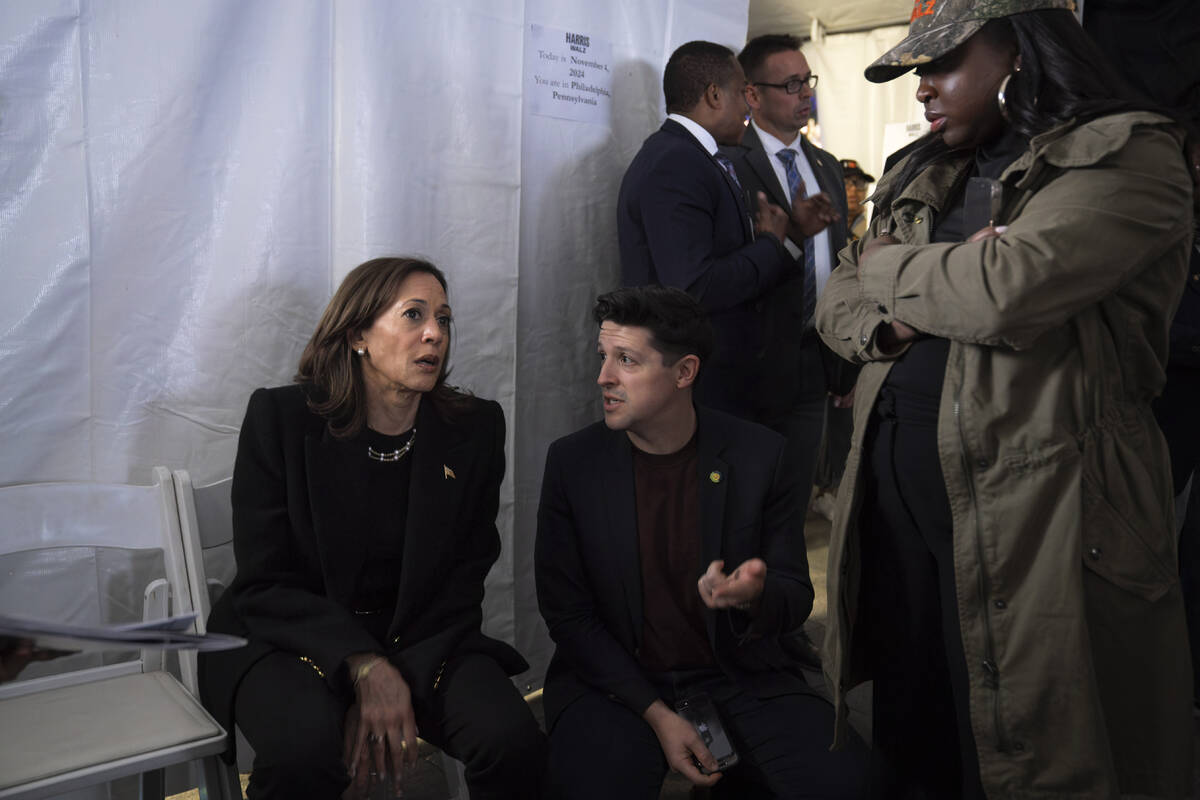 Democratic presidential nominee Vice President Kamala Harris, left, speaks with Ike Irby, senio ...