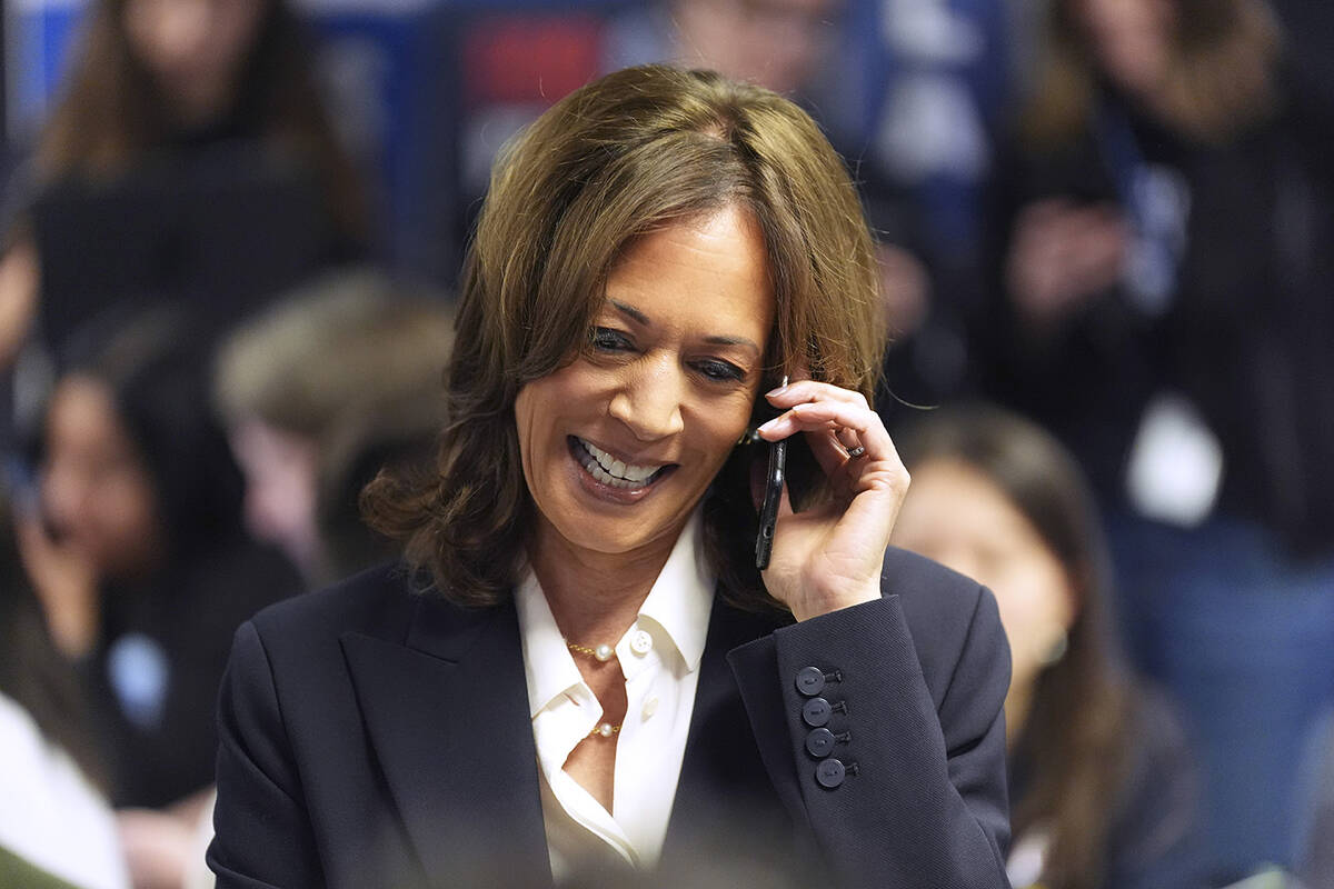 Democratic presidential nominee Vice President Kamala Harris phone banks with volunteers at the ...