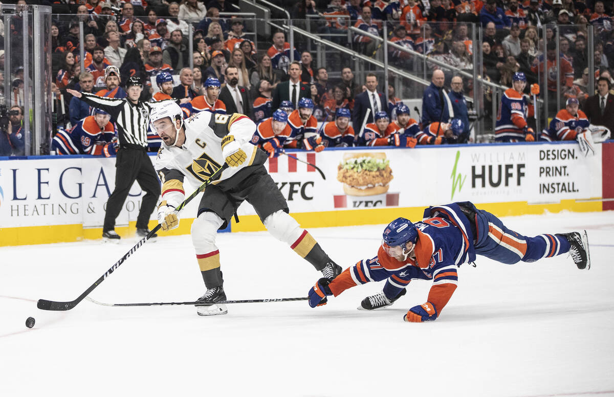 Vegas Golden Knights' Mark Stone (61) get the open net goal as Edmonton Oilers' Connor McDavid ...