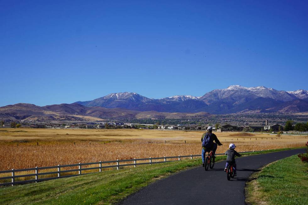 Bicyclists enjoy views of Mount Rose and the Sierra Nevada foothills during their recent ride o ...