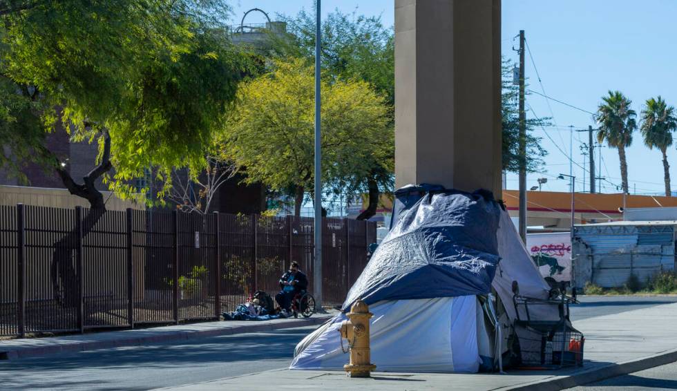 Homeless campers claim spots on the sidewalk along West Wilson Avenue on Wednesday, Nov. 6, 202 ...