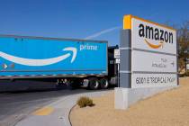 An Amazon Prime truck enters Amazon Distribution Center at an industrial area centered around T ...