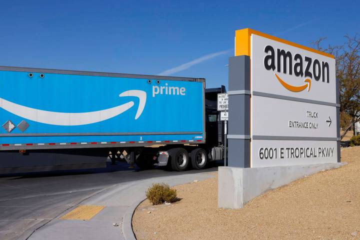 An Amazon Prime truck enters Amazon Distribution Center at an industrial area centered around T ...