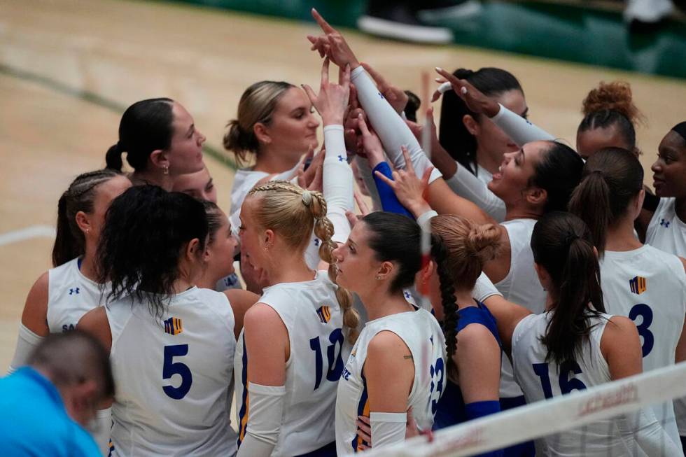 San Jose State players gather in a huddle before facing Colorado State in the first set of an N ...