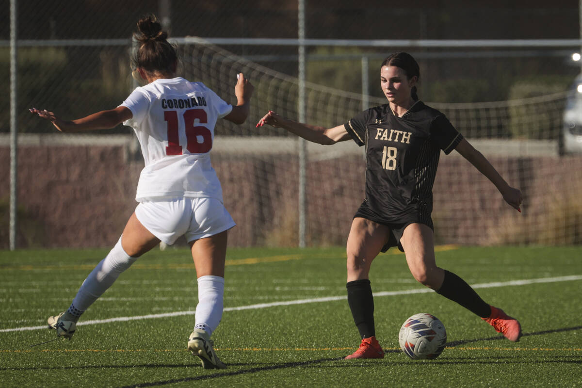 Faith Lutheran's Addison Jarvis (18) kicks the ball against Coronado's Mia Schlachter (16) duri ...