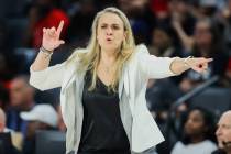 Aces head coach Becky Hammon coaches from the sidelines during a WNBA basketball game between t ...