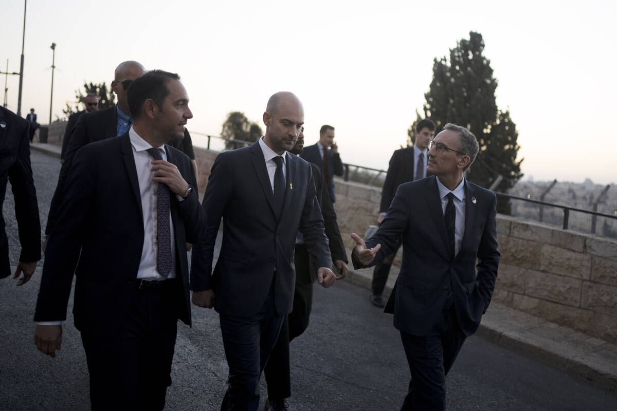 French Foreign Minister Jean-Noël Barrot, center, walks with staff on the Mount of Olives ...