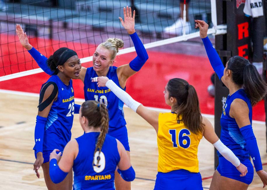 San Jose State setter Brooke Slusser (10) celebrates a point with teammates against UNLV during ...