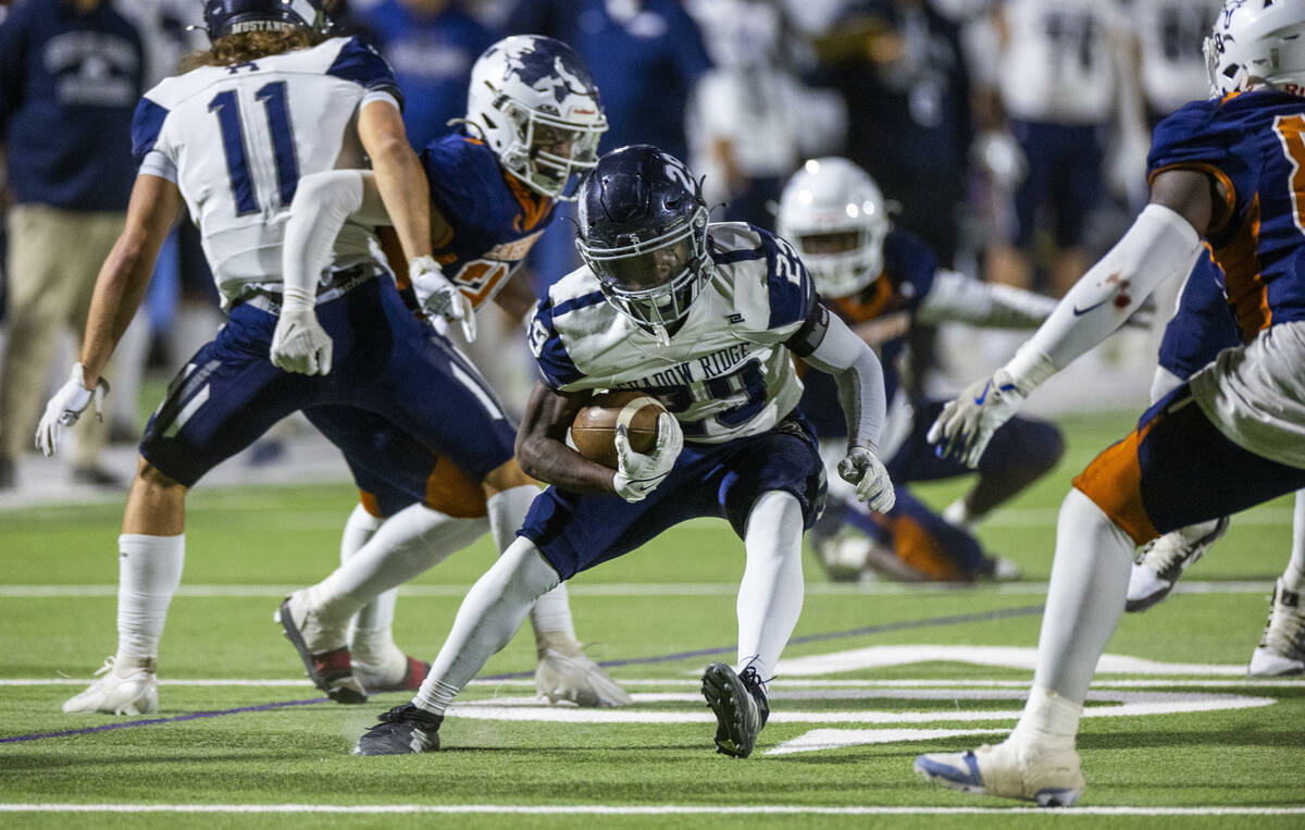 Shadow Ridge fullback Trevin Young (29) evades a Legacy tackle attempt during the first half of ...