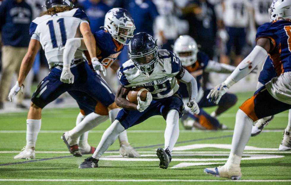 Shadow Ridge fullback Trevin Young (29) evades a Legacy tackle attempt during the first half of ...